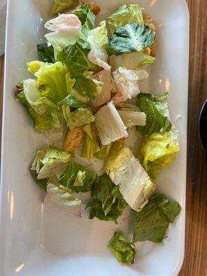 caesar salad with wilted brown lettuce.