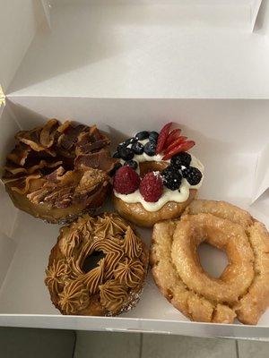 Maple bacon croissant donut, berry cream cheese donut, cookie butter funnel cake donut, old fashioned donut