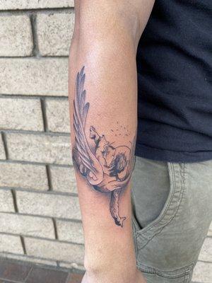 Falling angel tattoo