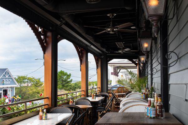 Upstairs deck with a beach view