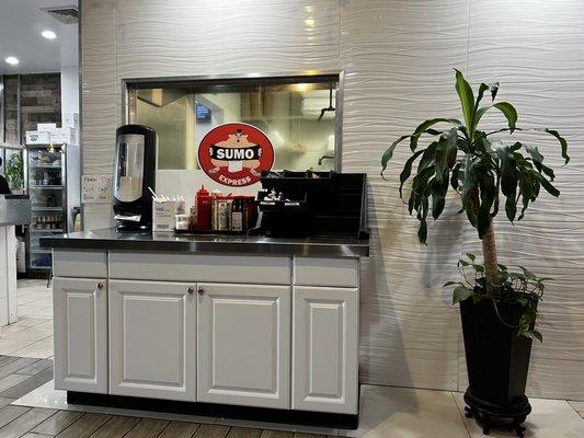 Condiments, utensils and napkins station.