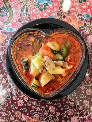 Duck curry with tomatoes, pineapple, Thai basil, and green peppers