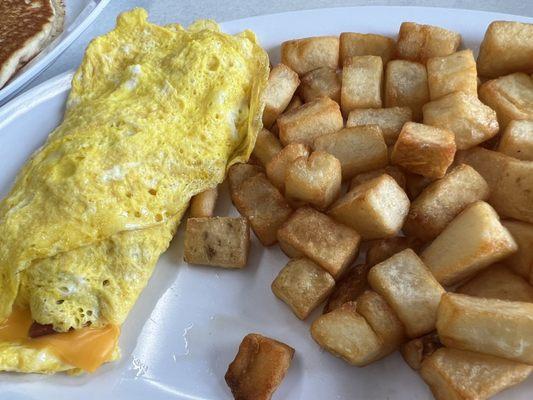 Cheese omelet and home fries