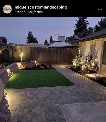 Picture of backyard at night with lights installed