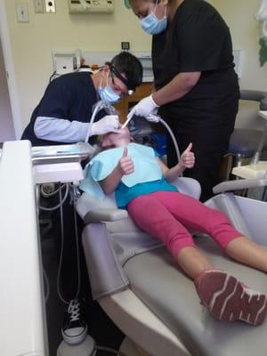 7 year old girl getting 4 cavities fixed, no shot/gas or novicaine needed. Dr. Nguyen is fantastic!!!