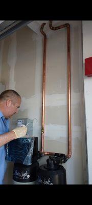 Our installer Steven Pound sweating some copper pipe.

-EC4 Water Softener

-QRS Whole house carbon filter