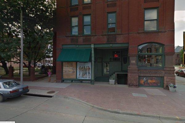 335 N. Main Ave Office Entrance around South Edge of Building by woman in pink.