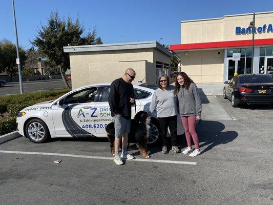 Instructor Rebecca with student driver Isabella, Isabella's dad and dog. This was Isabella's first driving lesson, way to go Isabella !