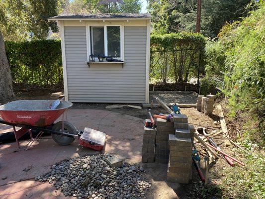 Laying the concrete for an outside storage area.