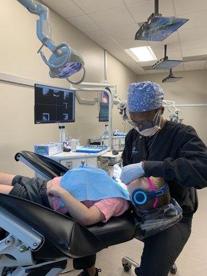 Patients get headphones and sunglasses.