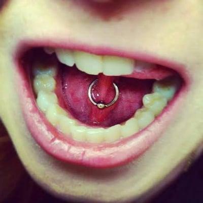 Tongue frenulum piercing by Tasha