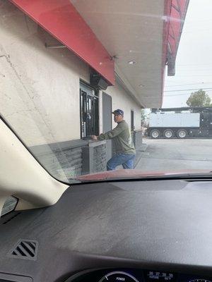 Pedestrian at the drive thru window.  Not sure why this is okay.