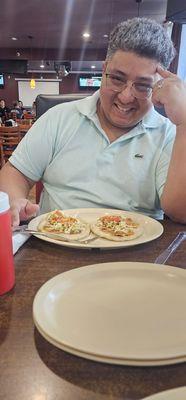 A happy man enjoying some goodness and love in a wonderful restaurant.