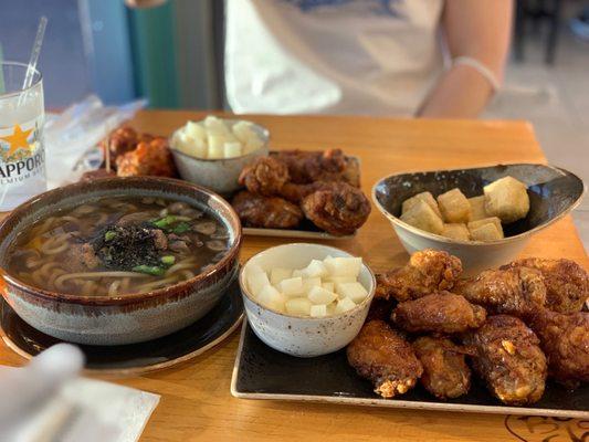 Udon Noodle Soup with bulgogi, Pickled Radish, Fried Chicken Combo with a side of fried tofu.