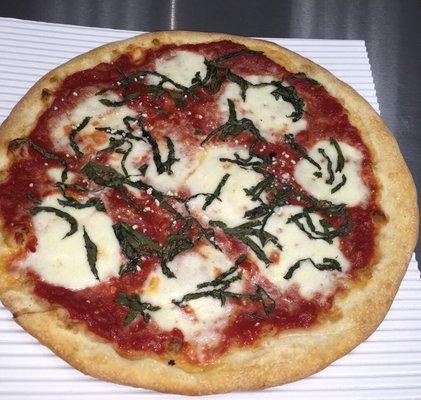 Margarita pizza from Peppino's. Fresh Buffalo mozzarella, vine ripened tomato sauce and sweet basil. Yum!