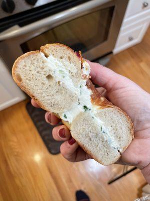 Cheddar Asiago bagel with  scallion cream cheese