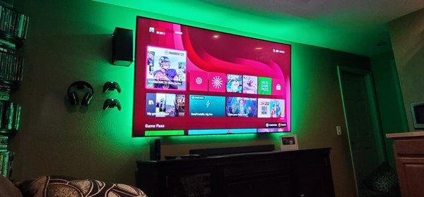 85 in tv installed with Xbox gaming system mounting and smart lighting