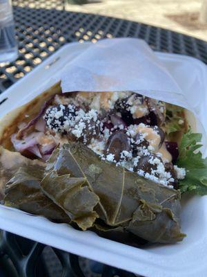 Pita with stuffed grape leaves