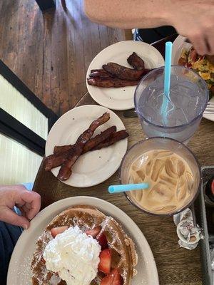 Side dog bacon, iced coffee, and waffles