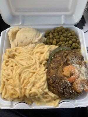 Stuffed pepper, baked spaghetti and cheese, potato salad, and green peas!