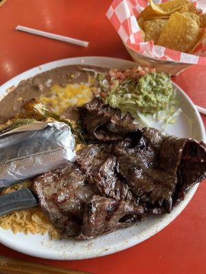 Carne asada meal with corn tortillas