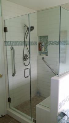 New shower with bench and grab bars.