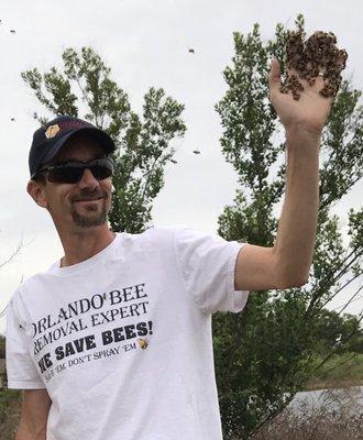 Dennis The Bee Guy with a handful of bees! We love bees. No-kill bee removal service. Orlando area.