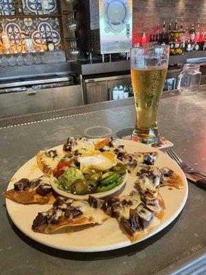 Beef fajita nachos and ice cold bud light.