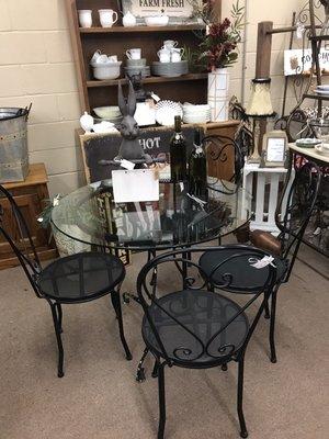 How about a glass and iron table with chairs?