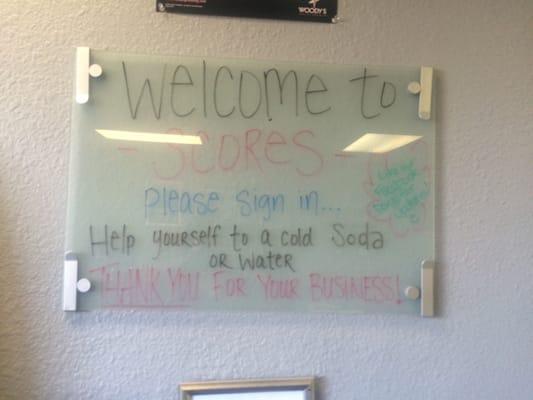 Welcome sign. Free soda and water while you wait.