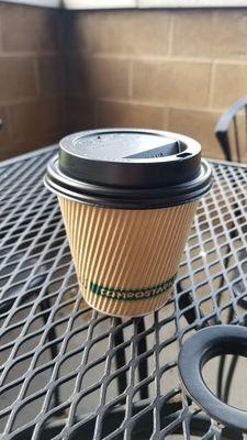 Enjoying lukewarm coffee on a very nice patio seating area