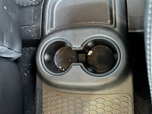 Rear center console cup holders still filthy looks untouched