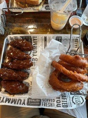 Chicken fingers with onion rings.