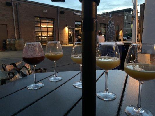 The Veil Memorial Day Weekend after sunset with the wine glasses and an umbrella table. Super chill.