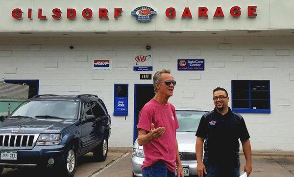 Brandon speaking with a customer in the front lot