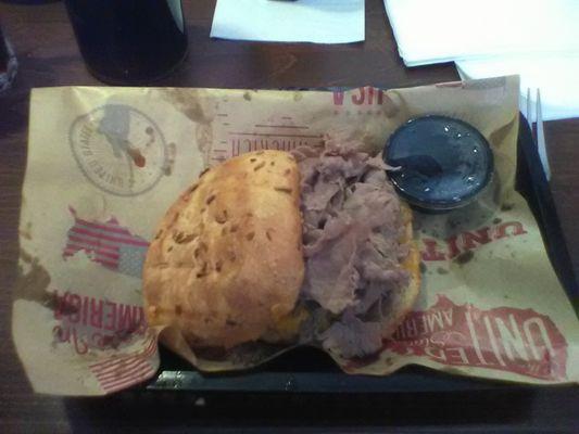 The "Big O".  That's a roast beef sandwich with quite a lot of beef, with cheddar, on an onion roll bun.  Comes au jus.