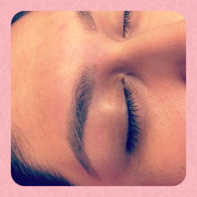 Brow shaping with hard wax that is meant for sensitive skin.