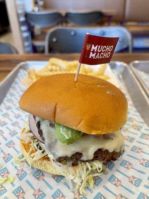 Mucho Macho burger with chorizo, pepper jack, libre sauce, Amazon sauce, jalapeños, lettuce, and onions.