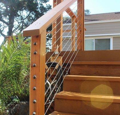 NEW cable hand rails on this custom redwood fence deck!