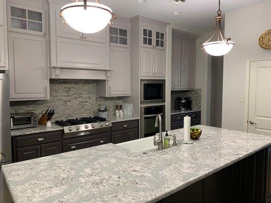 Backsplash: Zodia Interlocking 

Countertop: Summer Hill Quartz