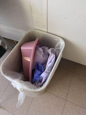 More fecal matter in an open trash bin just left in the patients room.