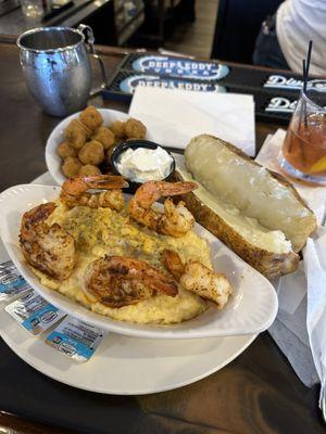 Shrimp and grits, baked potato, and okra.