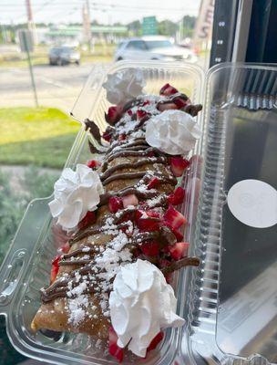 Indulge in the signature delight of our Strawberry & Nutella Crepe.