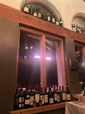 Love the rustic country Italian ambiance. Bottles of wine line every ledge in the little house.