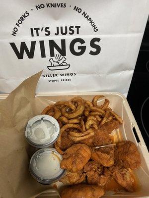 Boneless wings and curly fries with ranch dressing