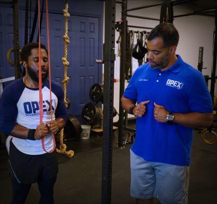 Coach Waldo teaching proper technique.