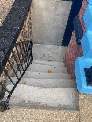 Refined retaining wall, staircase and basement area.