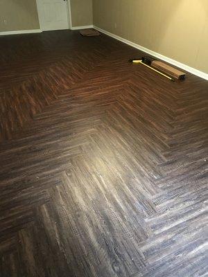 LVT flooring installed by us on a herringbone pattern