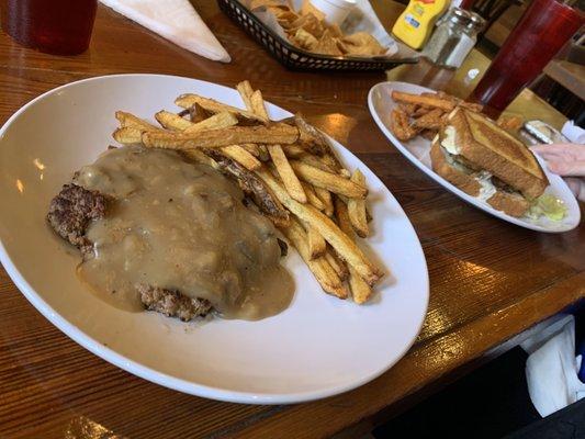 Hamburger Steak with onion gravy and fries.