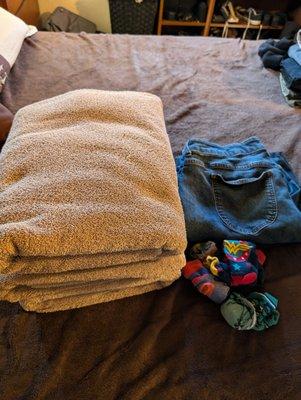 Folded towels, pants and tucked pairs of socks!